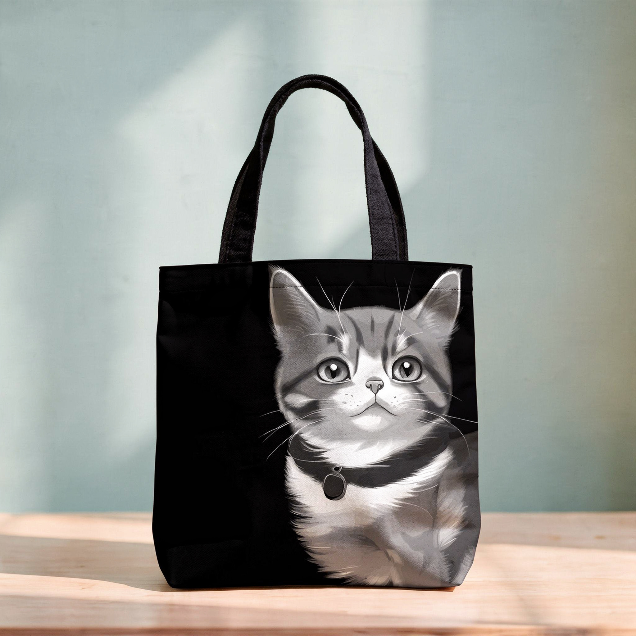Cat close up striking eyes tote bag